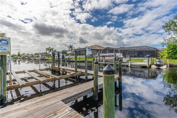 Dock featuring a water view and boat lift