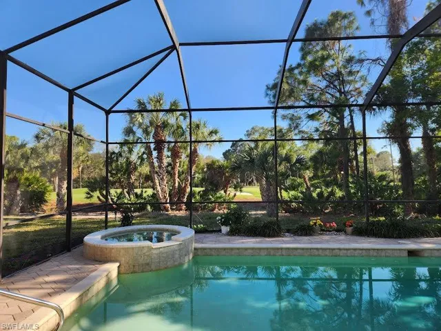 Integrated pool / spa with a lanai and a sunroom