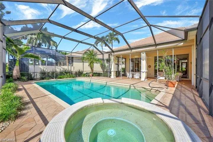 Integrated pool / hot tub featuring a patio area, a sunroom, and a lanai