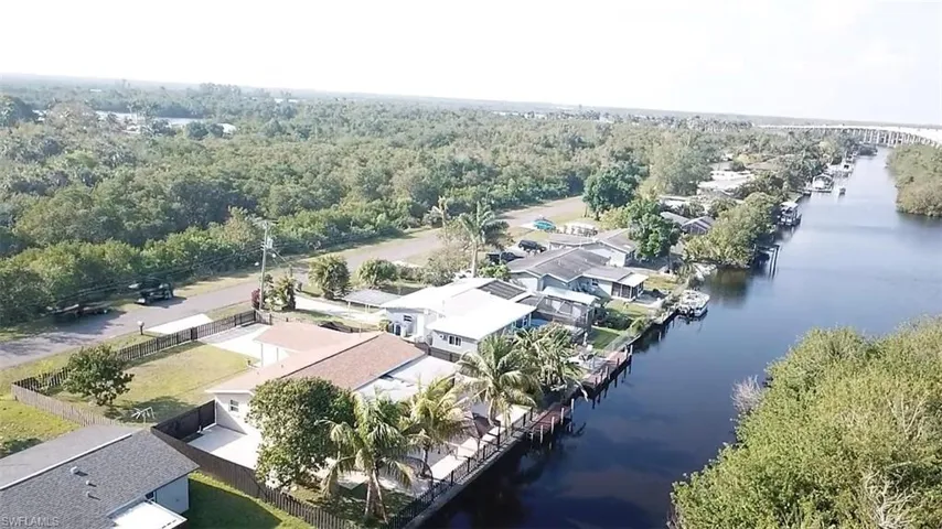 Drone / aerial view featuring a water view and a residential view