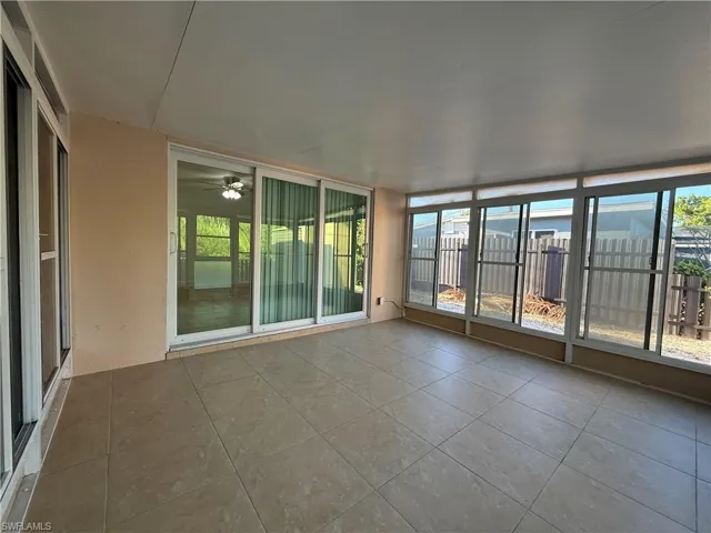 Unfurnished sunroom featuring a wealth of natural light