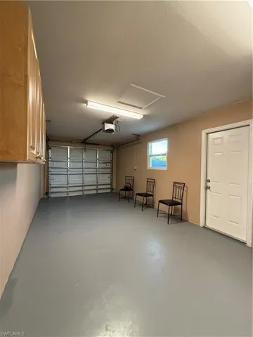 Garage featuring a garage door opener
