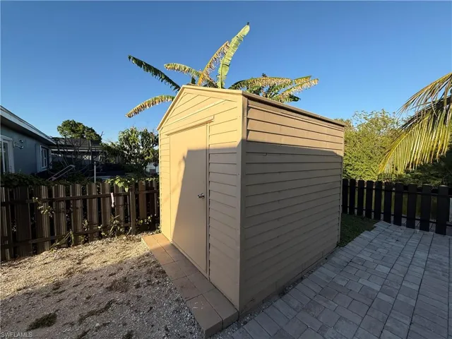 View of shed featuring a fenced backyard