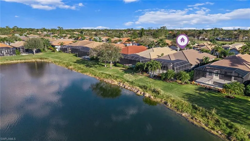 Aerial view of residential area with a large body of water