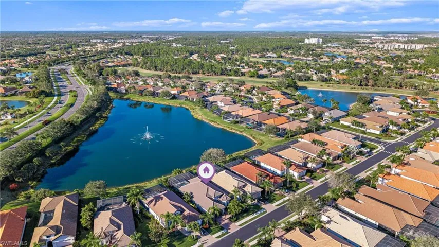 View of property location featuring nearby suburban area and a lake view