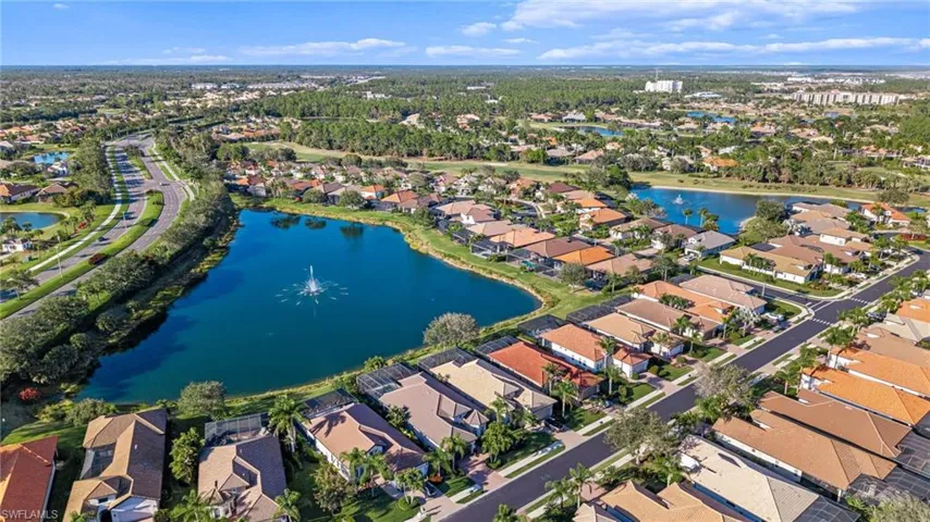 Aerial overview of property's location with nearby suburban area and a large lake