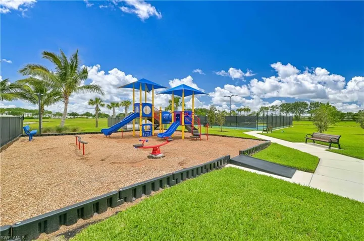 View of playground with a yard