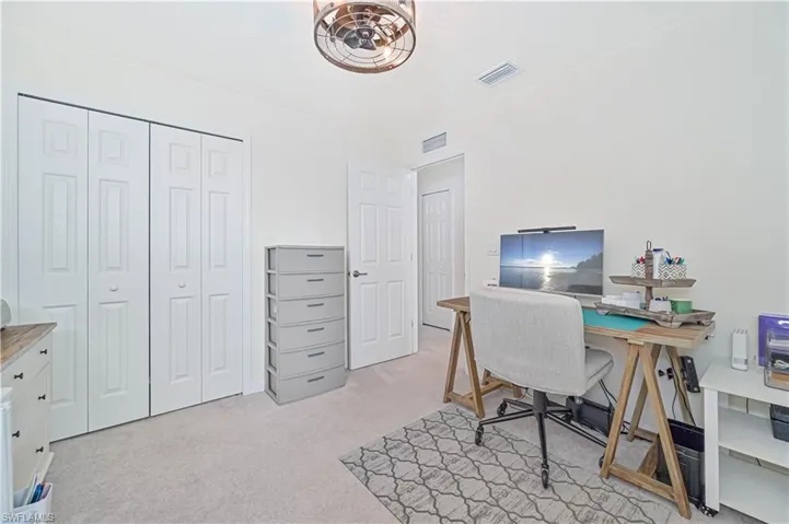 Office featuring light carpet