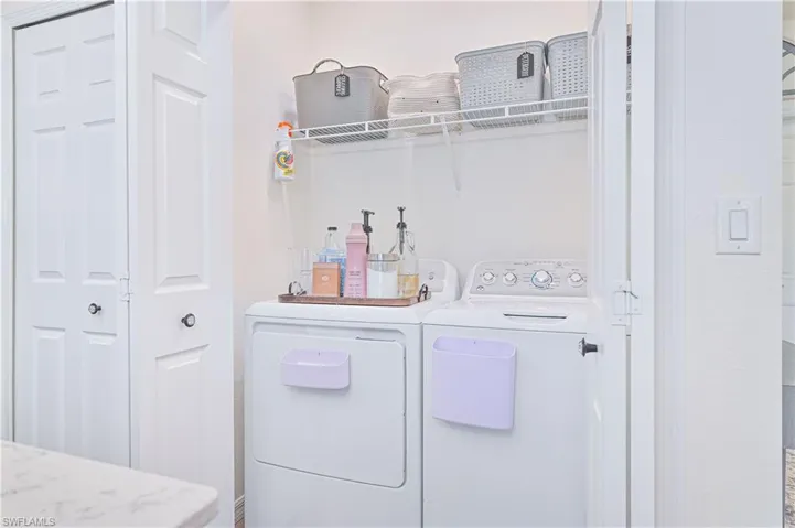 Laundry area featuring separate washer and dryer