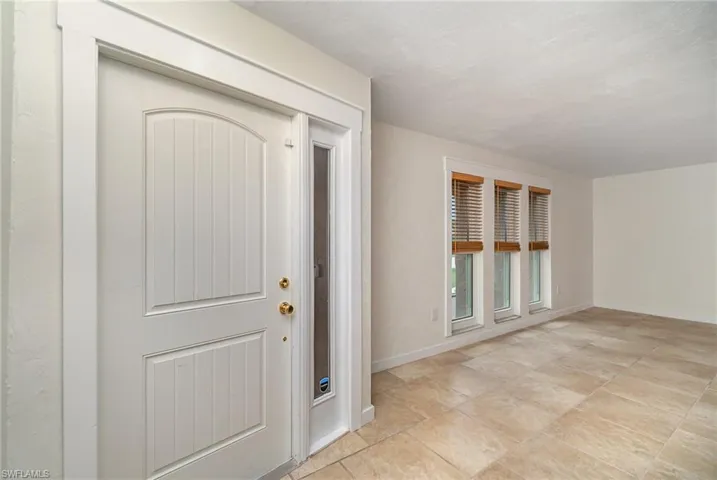 Front door and Living Room view.