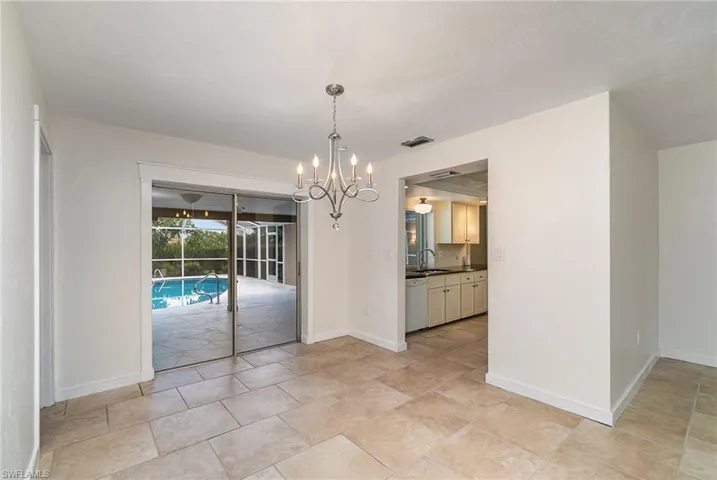 Dining area with Pocketing sliding glass doors to the pool.