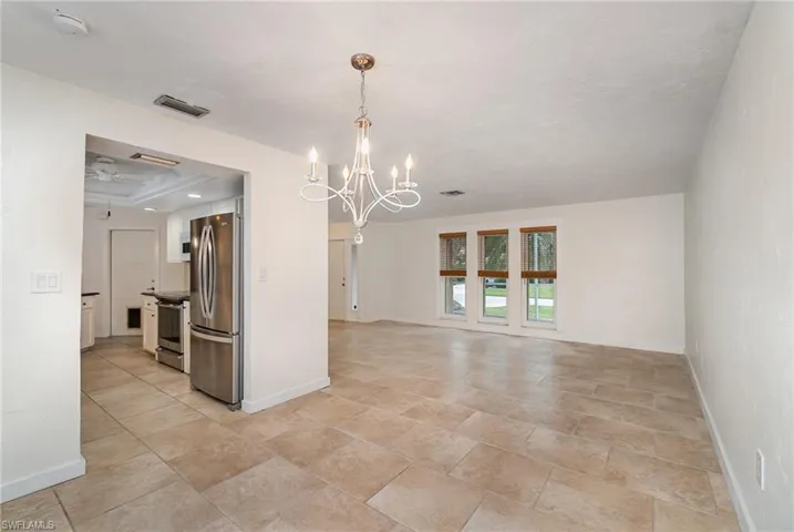 View of dining room to living room and kitchen.