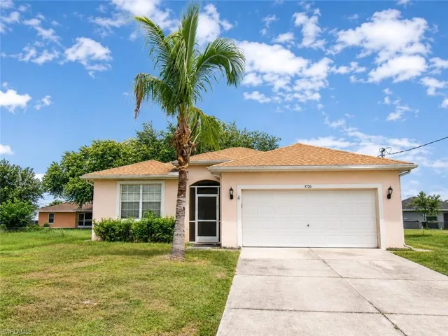 Single-story exterior with a light-toned stucco finish