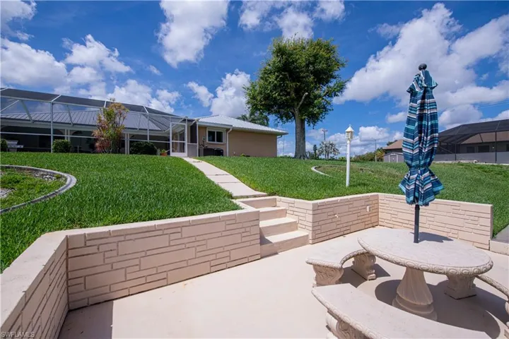 View of concrete dock and back of house