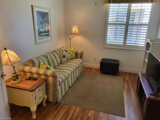 TV viewing with hide-a-bed sofa and desk.