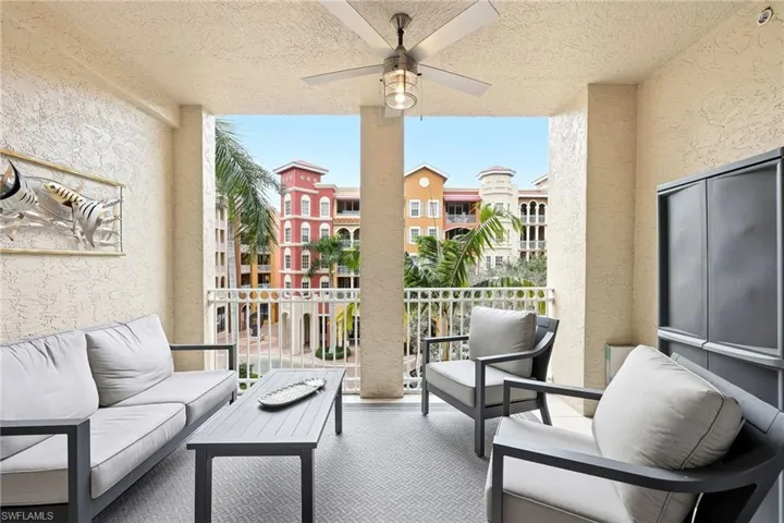 Balcony with a ceiling fan and outdoor lounge area