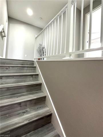 Staircase and landing in front of Primary bedrm.
