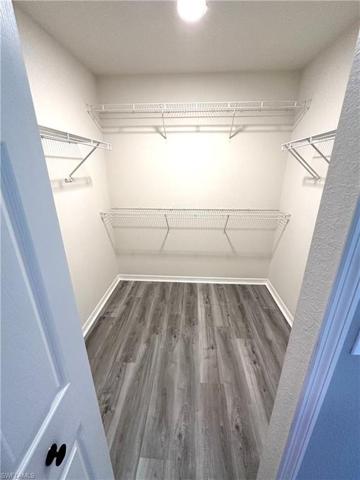Primary bedroom closet 1