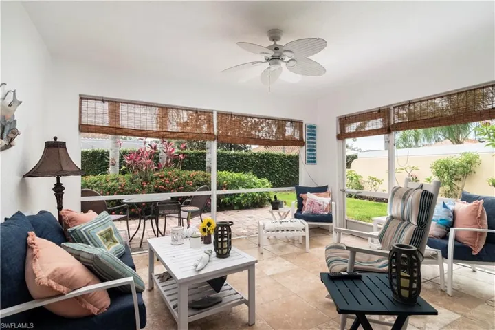 Sunroom with an outdoor hangout area, a ceiling fan, and outdoor dining space