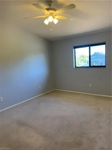 Bedroom with carpet and ceiling fan
