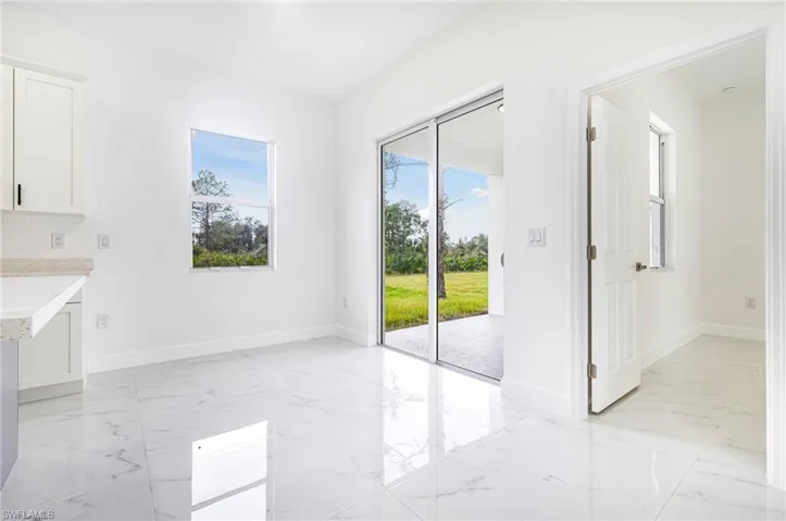 Unfurnished dining area featuring a wealth of natural light