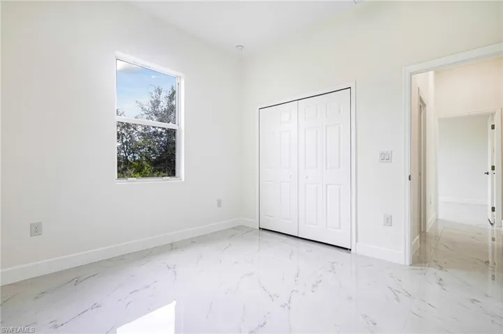 Unfurnished bedroom featuring a closet