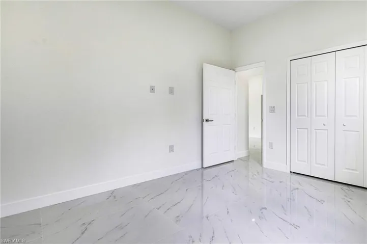 Unfurnished bedroom featuring a closet