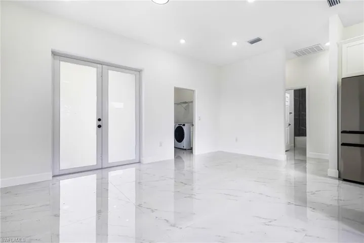 Spare room with french doors