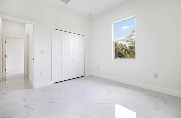 Unfurnished bedroom with a closet