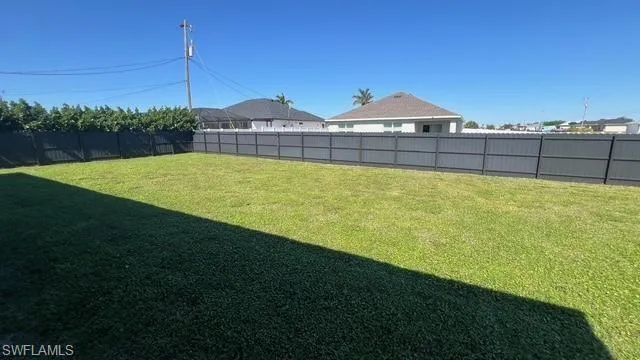View of fenced backyard