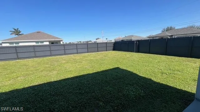 View of fenced backyard
