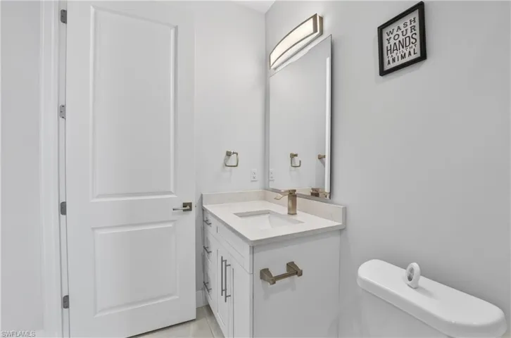 Half bath with vanity and toilet