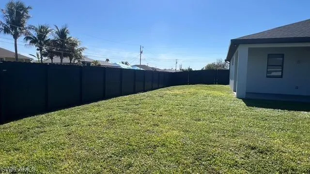 View of fenced backyard
