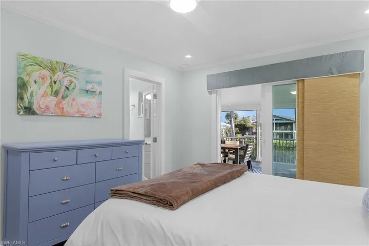 Bedroom with crown molding, recessed lighting, and a ceiling fan