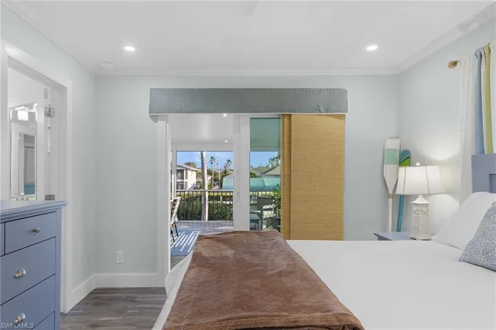 Interior room featuring wood-finish flooring and recessed lighting