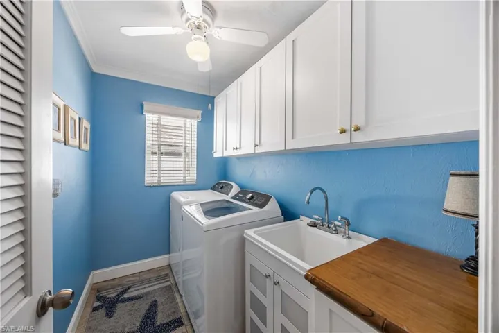 Laundry will be FUN inside this well equipped laundry room including a deep utility sink.