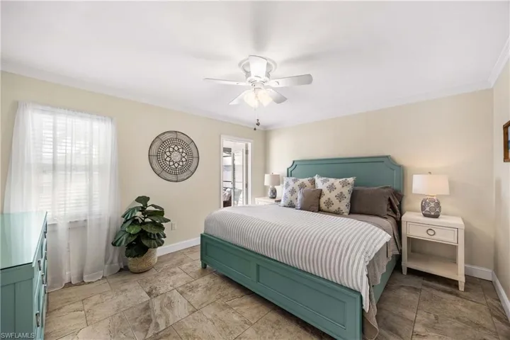Master bedroom with crown molding, custom built in cabinets and ensuite bath.  Easy-quick door access to your sparkling pool too!