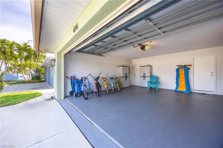 Large double garage includes pull down stairs to attic for additional storage.