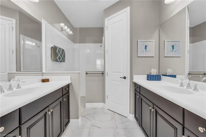 Bathroom with walk in shower and vanity