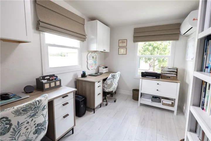 Office featuring AC and light wood-type flooring