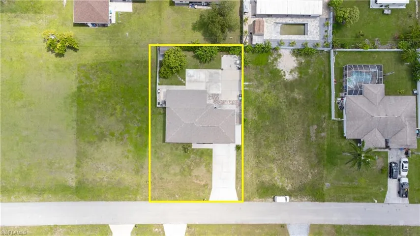 Aerial perspective of suburban area featuring property parcel outlined