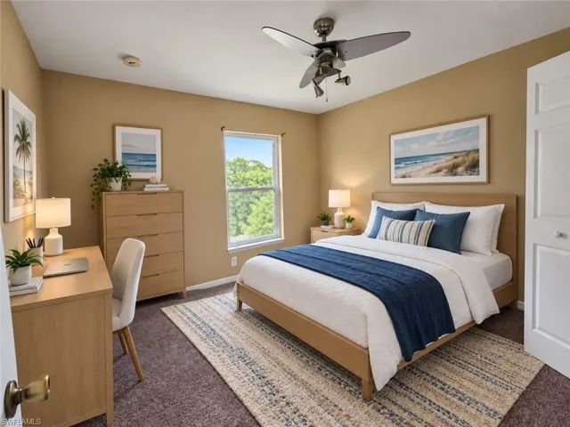 Ceiling fan with integrated lighting, window with exterior greenery, wood-finish flooring, wood-finish desk, and wood-finish dresser