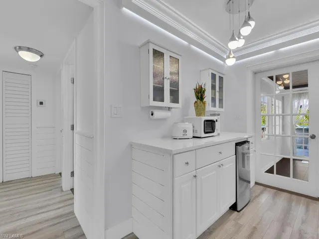 Personalized coffee bar and breakfast area with additional mini refrigertaor and additional cabinentry for extra storage.