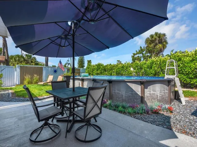 View from patio featuring a fenced in pool