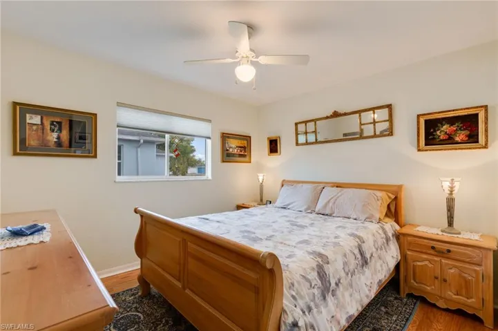 Bedroom with wood finished floors and ceiling fan
