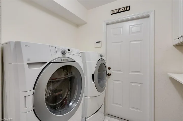 Laundry room featuring washing machine and clothes dryer