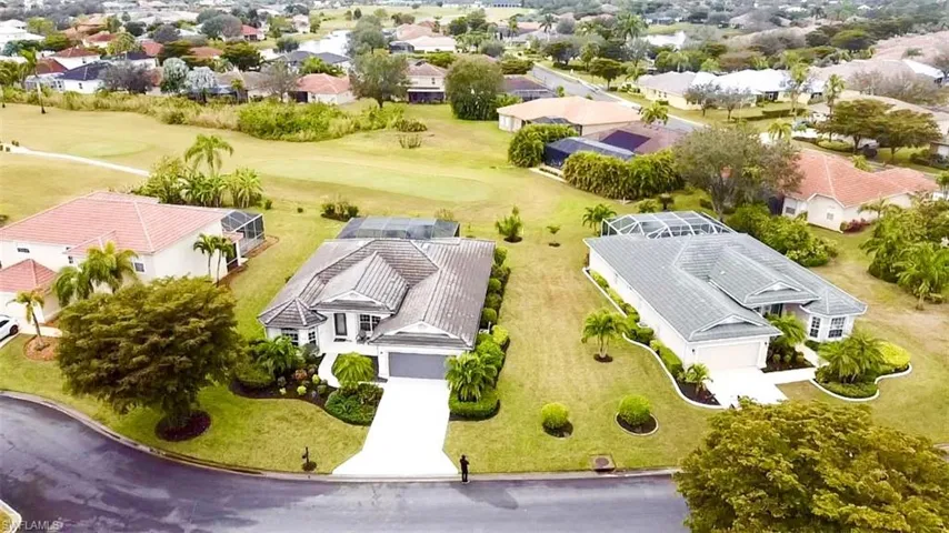 Aerial perspective of suburban area with a golf course