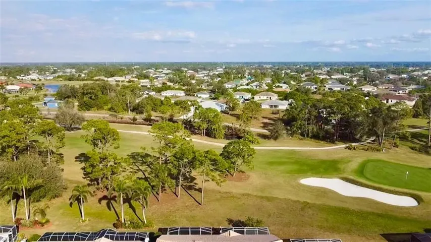 Aerial view of residential area featuring a local golf course