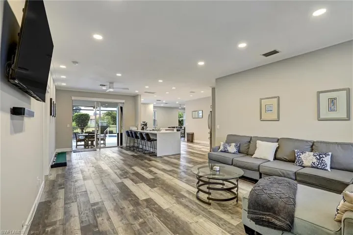 Living area featuring recessed lighting, light wood-style floors, and a ceiling fan