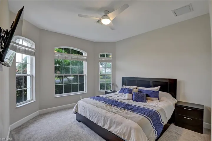 Bedroom featuring carpet flooring and a ceiling fan